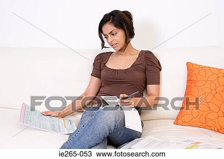 A woman writing a cheque View Large Photo Image Stock Image - A woman writing a cheque. Fotosearch