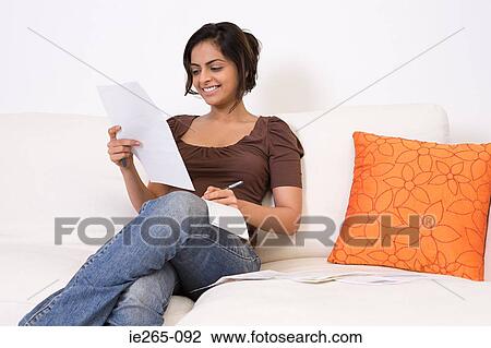 A woman writing a cheque View Large Photo Image Stock Image - A woman writing a cheque. Fotosearch