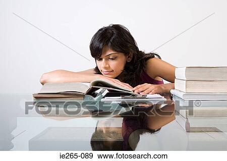 A young woman studying View Large Photo Image Stock Photo - A young woman studying. Fotosearch