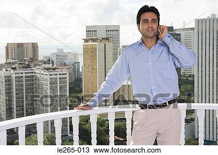 Stock Image - Man using cell phone. Fotosearch