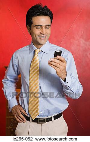 Man using cell phone View Large Photo Image Stock Image - Man using cell phone. Fotosearch