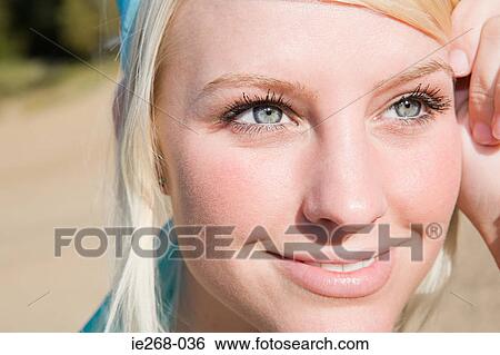 Stock Photograph - Close up of a young womans face. Fotosearch