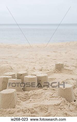 Sand castles on a beach View Large Photo Image Stock Image - Sand castles on a beach. Fotosearch