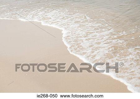 Sea surf on the beach View Large Photo Image Stock Image - Sea surf on the beach. Fotosearch