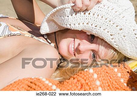 Smiling woman sunbathing View Large Photo Image Stock Image - Smiling woman sunbathing. Fotosearch