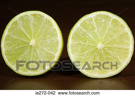 Stock Image - Lime cut in half. Fotosearch