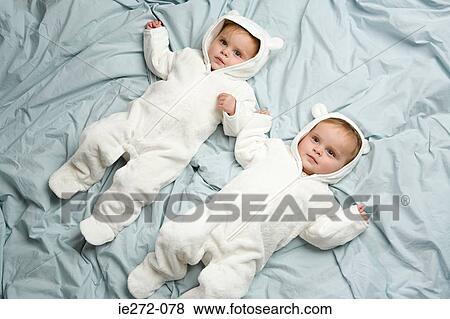 Stock Photo - Twin babies. Fotosearch