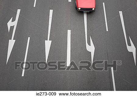 Arrow signs on a road and a car View Large Photo Image Stock Photo - Arrow signs on a road and a car. Fotosearch