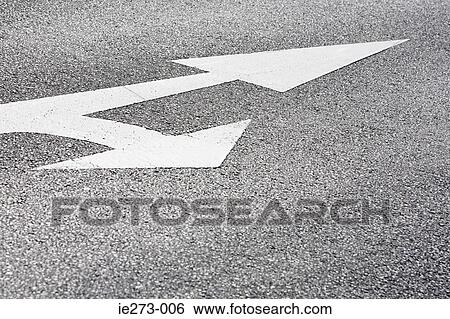 Stock Photograph - Arrow signs on a road. Fotosearch