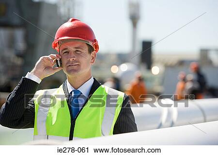 Engineer on cellphone View Large Photo Image Stock Image - Engineer on cellphone. Fotosearch