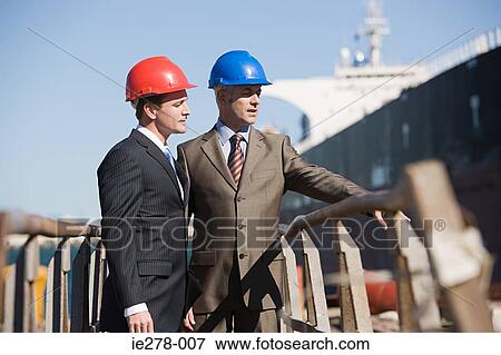 Stock Photo - Engineers at harbour. Fotosearch