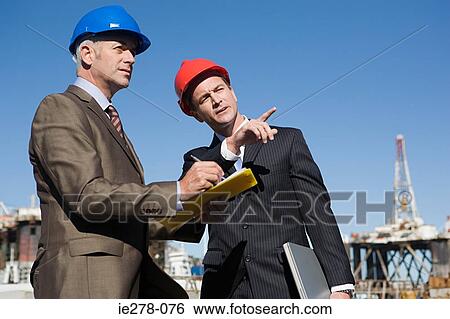 Stock Photograph - Engineers at harbour. Fotosearch
