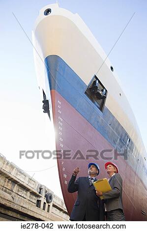 Engineers by ship View Large Photo Image Stock Image - Engineers by ship. Fotosearch