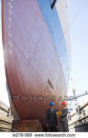 Engineers by ship View Large Photo Image Stock Photo - Engineers by ship. Fotosearch
