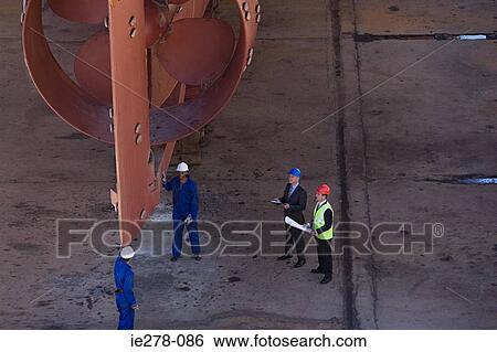Engineers by ship View Large Photo Image Stock Photograph - Engineers by ship. Fotosearch