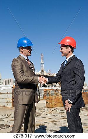 Engineers shaking hands View Large Photo Image Stock Photo - Engineers shaking hands. Fotosearch