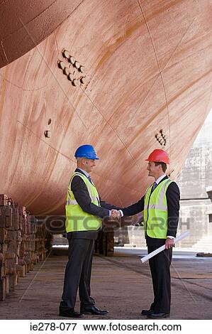 Engineers shaking hands View Large Photo Image Stock Photo - Engineers shaking hands. Fotosearch