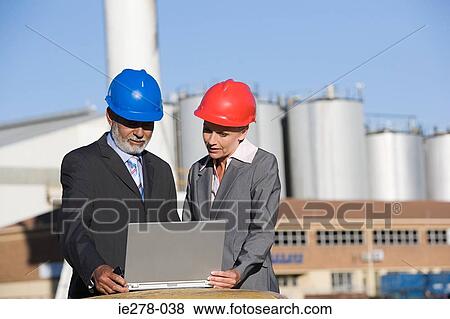 Engineers with laptop View Large Photo Image Stock Photo - Engineers with laptop. Fotosearch
