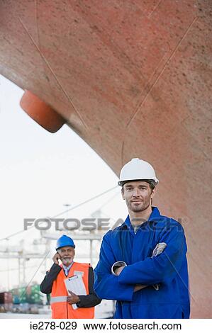 Workers by ship View Large Photo Image Stock Photo - Workers by ship. Fotosearch