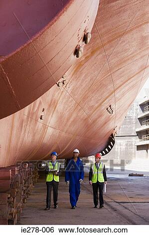 Workers by ship View Large Photo Image Stock Photograph - Workers by ship. Fotosearch