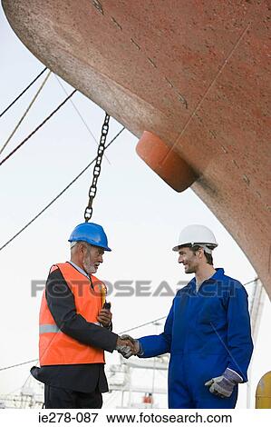 Workers shaking hands View Large Photo Image Stock Photo - Workers shaking hands. Fotosearch