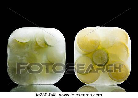 Stock Photo - Frozen limes and lemons. Fotosearch