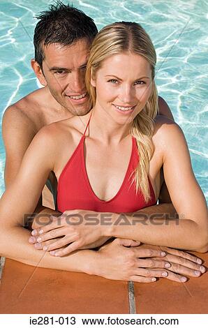 A couple in a swimming pool View Large Photo Image Stock Image - A couple in a swimming pool. Fotosearch