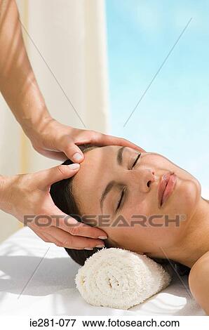 A woman having a head massage View Large Photo Image Stock Photo - A woman having a head massage. Fotosearch