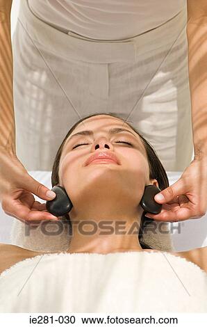A woman having stone therapy View Large Photo Image Stock Image - A woman having stone therapy. Fotosearch