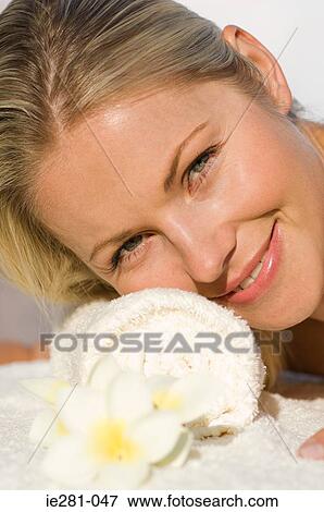 Stock Photo - A woman relaxing at a health farm. Fotosearch