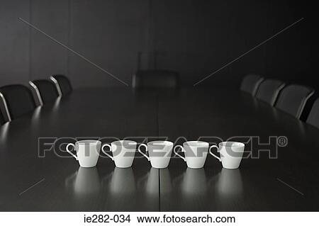 Picture - Coffee cups on a conference table. Fotosearch