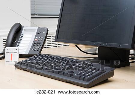Computer and telephone in office View Large Photo Image Stock Image - Computer and telephone in office. Fotosearch