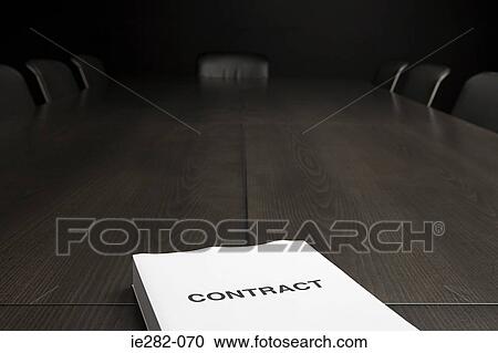 Stock Image - Contract on a conference table. Fotosearch