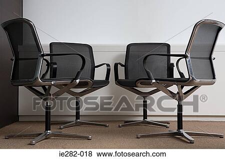 Four office chairs View Large Photo Image Stock Photo - Four office chairs. Fotosearch