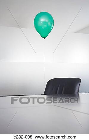 Green balloon in an office View Large Photo Image Stock Photo - Green balloon in an office. Fotosearch
