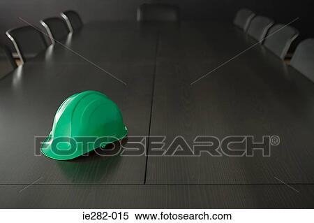 Hard hat on a conference table View Large Photo Image Stock Photography - Hard hat on a conference table. Fotosearch
