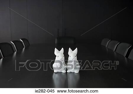 Two rabbit figurines on table View Large Photo Image Stock Photography - Two rabbit figurines on table. Fotosearch