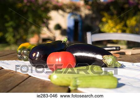 Fresh vegetables on a table View Large Photo Image Stock Photograph - Fresh vegetables on a table. Fotosearch