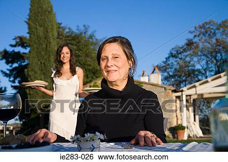 Italian mother and daughter at lunch View Large Photo Image Stock Photograph - Italian mother and daughter at lunch. Fotosearch