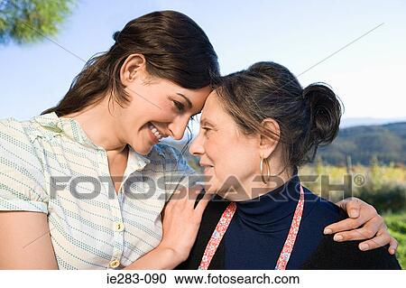 Italian mother and daughter hugging View Large Photo Image Stock Image - Italian mother and daughter hugging. Fotosearch