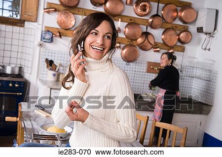 Italian mother and daughter in kitchen View Large Photo Image Stock Image - Italian mother and daughter in kitchen. Fotosearch