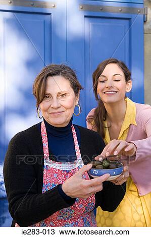 Italian mother and daughter with olives View Large Photo Image Stock Image - Italian mother and daughter with olives. Fotosearch