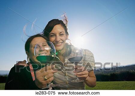 Mother and daughter drinking wine View Large Photo Image Stock Photography - Mother and daughter drinking wine. Fotosearch