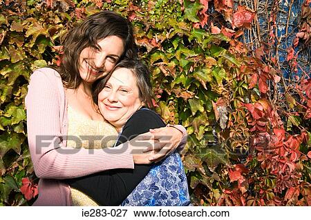 Mother and daughter hugging View Large Photo Image Stock Photo - Mother and daughter hugging. Fotosearch