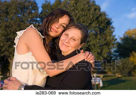 Mother and daughter hugging View Large Photo Image Stock Photo - Mother and daughter hugging. Fotosearch