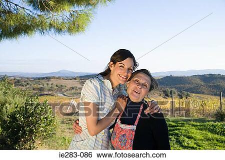 Mother and daughter hugging View Large Photo Image Stock Photograph - Mother and daughter hugging. Fotosearch
