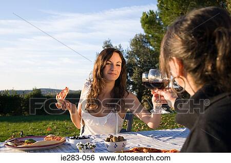 Mother and daughter toasting with red wine View Large Photo Image Stock Photograph - Mother and daughter toasting with red wine. Fotosearch