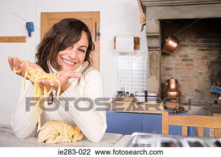Woman holding pasta dough View Large Photo Image Stock Image - Woman holding pasta dough. Fotosearch