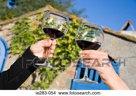 Women toasting with red wine View Large Photo Image Picture - Women toasting with red wine. Fotosearch
