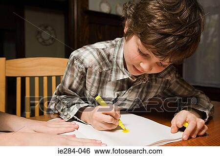 A boy drawing View Large Photo Image Stock Photograph - A boy drawing. Fotosearch
